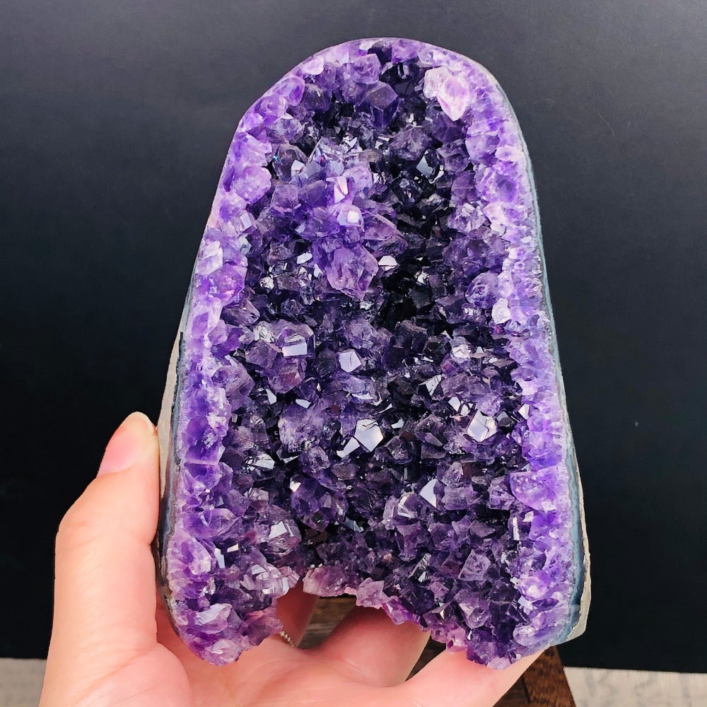 Close-up of the amethyst geode's crystal cavity against a dark background