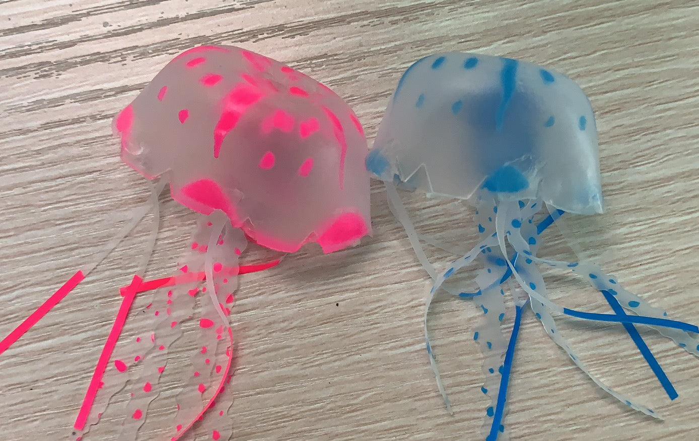 Close-up of the two hand-painted silicone jellyfish figures
